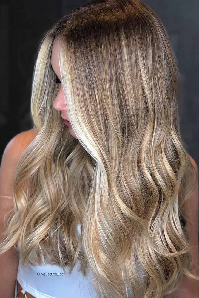 dirty-blonde-hair-styles-long-wavy-sleek-face-framing-balayage