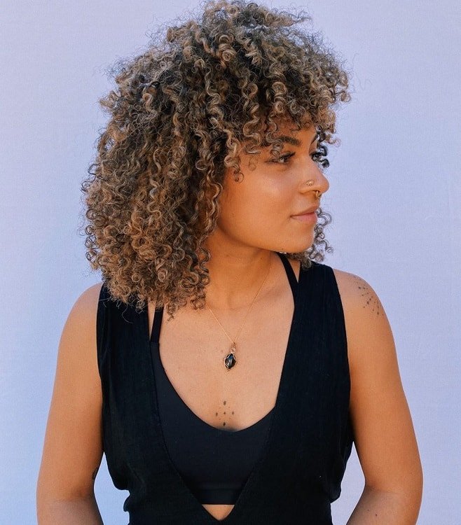 Curly Hair women with Blonde Highlights