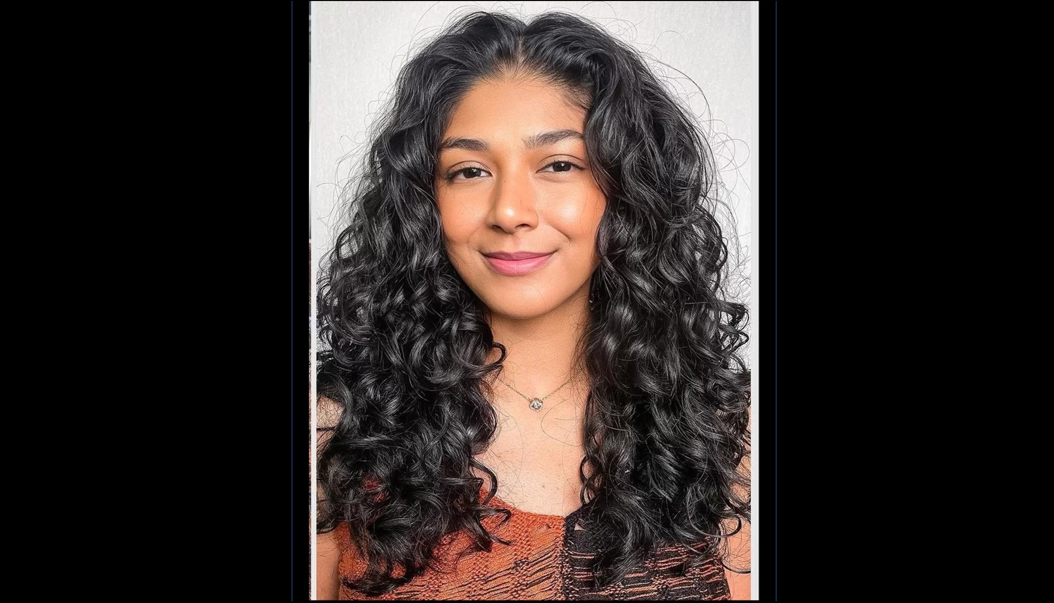 Bespoke curly cut with hydration-first finish at Hera Hair Beauty — slide four